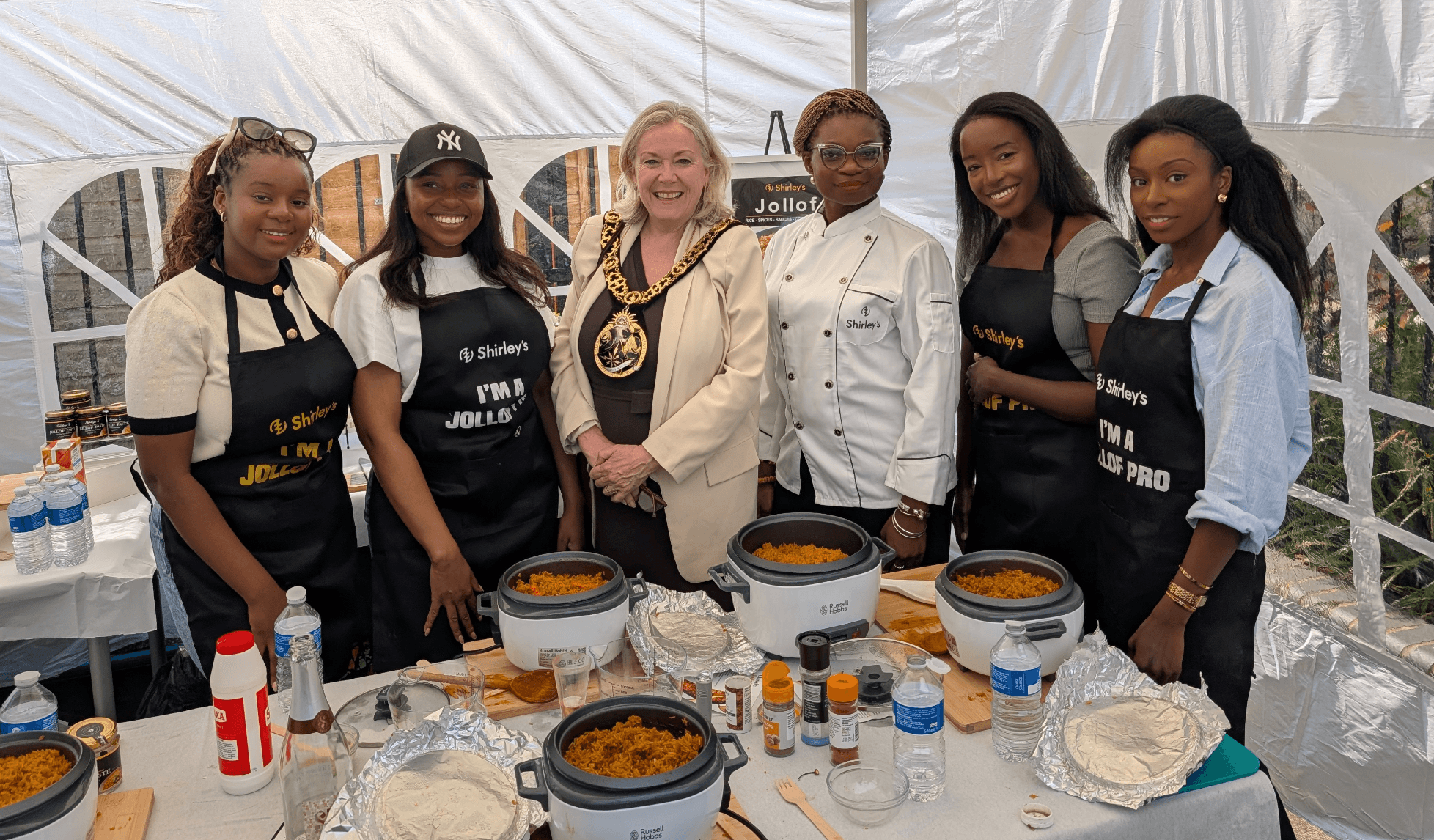 Group cooking class with official and students