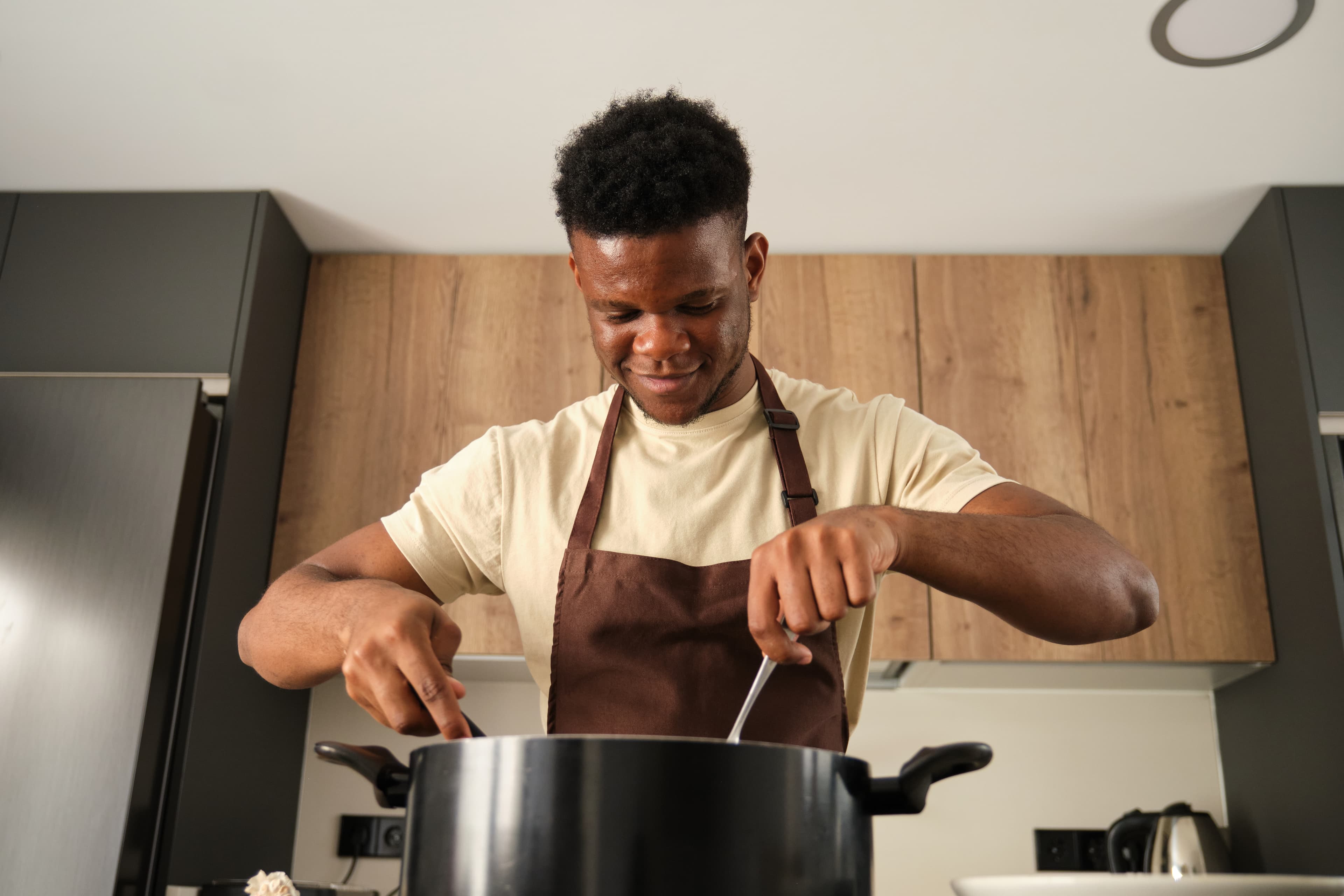 Student learning to cook West African cuisine