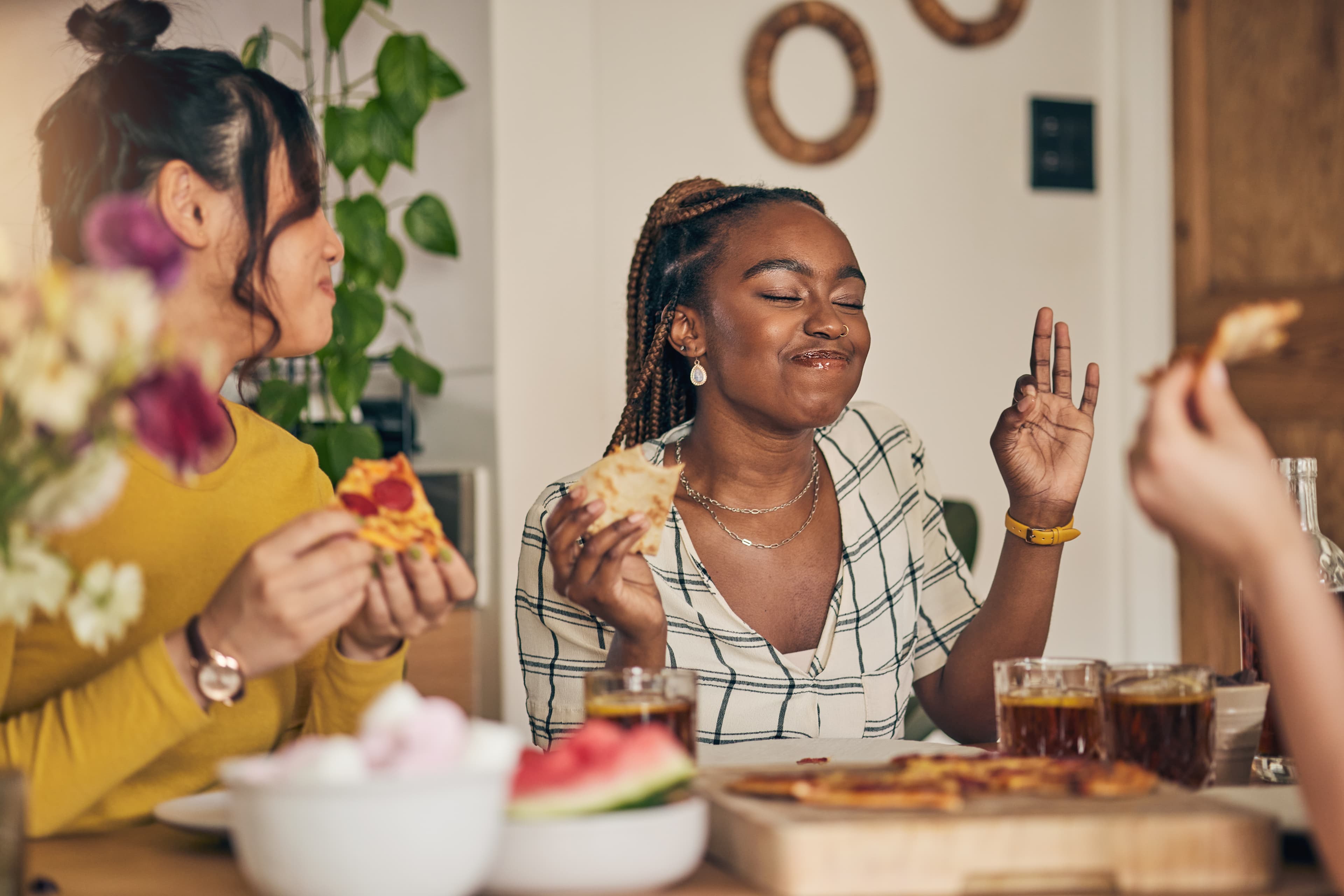 Friends enjoying pizza together